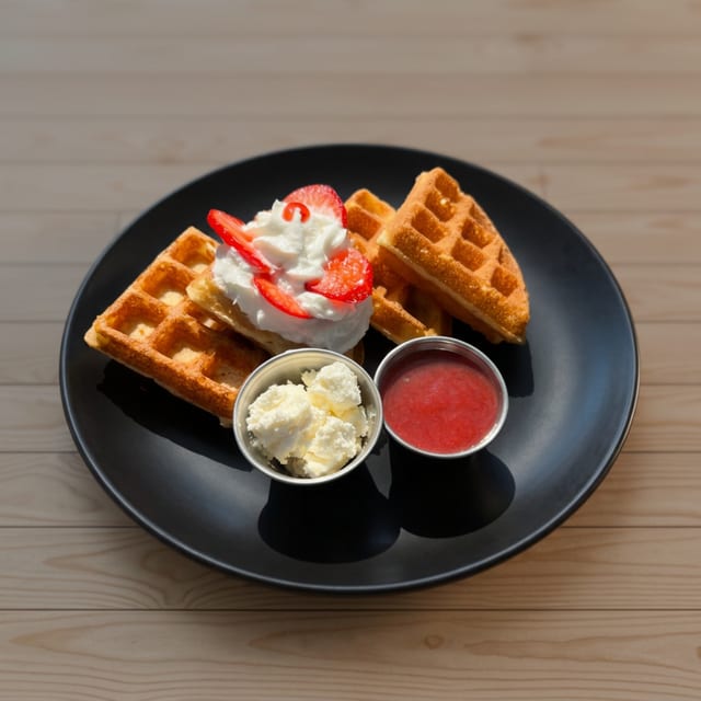 Belgian Waffle with Whipped Cream and Berry Jam.